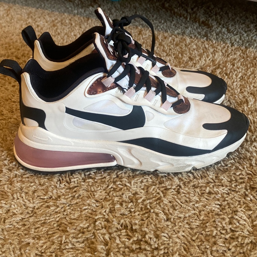 White and black Nike fitness shoes with cheetah print down front and inside